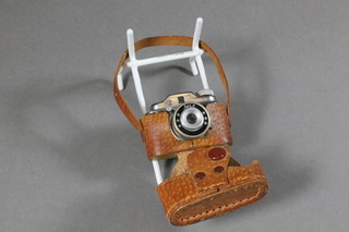 A miniature HIT camera complete with leather case 2"