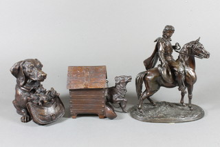 A reproduction money box in the form of a dogs kennel, the base  marked Geschutzt 3", a bronze money box in the form of a dogs  head and a spelter figure of a cavalier 8"