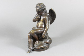 A 19th Century bronze figure of a seated Cupid with quiver and  arrows 8"