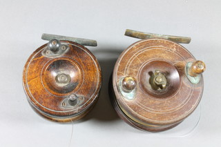 A 19th Century wooden Starback centre pin fishing reel 4" and 1 other centre pin reel 4.5"
