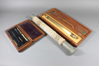 An Officer of the Watch single draw telescope by Gieves  no.9961, a wooden rolling ruler by W H Harling and a part geometry set