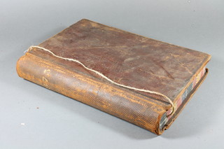A Victorian leather bound ledger, unused