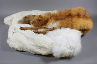 A lady's brown fur coat, a lady's white short fur coat and a gold  fox fur