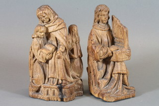A pair of 17th Century ecclesiastical carved wooden figures,  some worm, 8"h  ILLUSTRATED