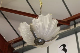 An Art Deco chrome and glass scallop shaped light shade