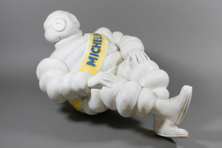 A plastic figure of a seated Michelin man 23"