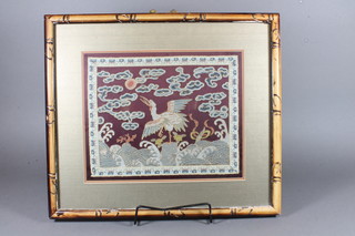 A Chinese stitchwork panel decorated a stork 9" x 11"