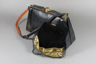 An Art Deco black snakeskin handbag with gilt metal mounts marked G.M Depose and a black velvet and green silk fascinator