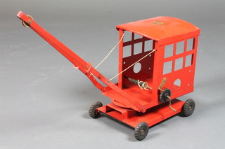 A Triang red painted model of a crane