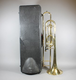 A brass trombone marked RD