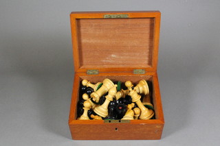 A complete Staunton chess set contained in a mahogany box
