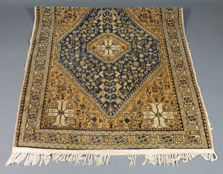 A Caucasian rug with blue diamond field to the centre within multi-row borders 57" x 41"
