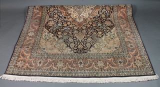 A fine quality pink ground Kashmir silk carpet with central medallion 110" x 73"