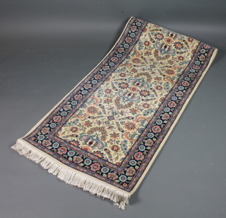 A white ground and floral patterned Persian runner 119" x 30"