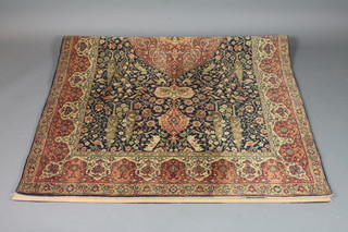 A Wilton Persian style carpet with central medallion decorated a garden 90" x 55"