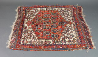An Antique Heriz rug with diamond to the centre within  multi-row border 46" x 30"