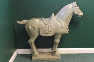 A carved green soapstone figure of a standing Tang style horse  37"h x 43"l