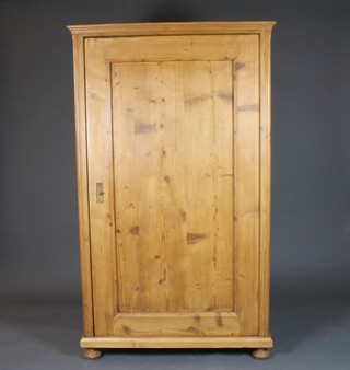 A French stripped and polished pine hall cupboard, fitted shelves enclosed by a panelled door 66"h x 39"w x 20"d