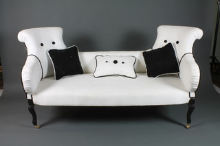 An unusual Victorian 2 seat conversation settee upholstered in  white brushed upholstery, raised on cabriole legs and casters 64"l
