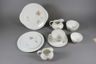 A 52 piece Royal Doulton tumbling leaves pattern tea service  comprising bread plate 9", 10 side plates 8.5" - 1 chipped, 10 tea  plates 6.5", 2 cream jugs, 2 sugar bowls, 9 cups, 18 saucers,  some contact marks