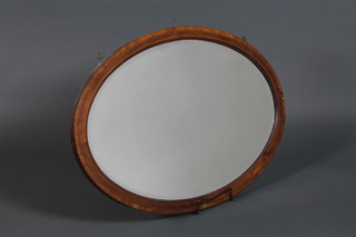 An Edwardian mahogany oval wall mirror, satinwood and  boxwood banded inset oval bevelled plate 22"h x 32"w