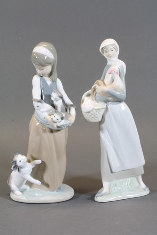 A Lladro figure of a standing girl with kittens, base marked 1309  9" and 1 other standing girl with basket and chicken, base  marked J23N 9"