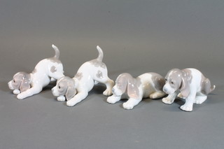 4 Lladro figures of puppies, base impressed 49 5"