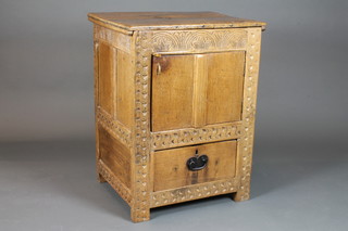 An 18th Century style carved honey oak cabinet with hinged lid,  fitted a cupboard above a drawer 36"h x 27"w x 21"d