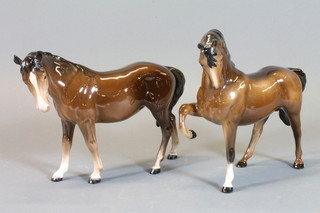 A Beswick figure of a standing bay horse with right leg crooked  7" and 1 other bay horse 7", left ear slightly chipped,