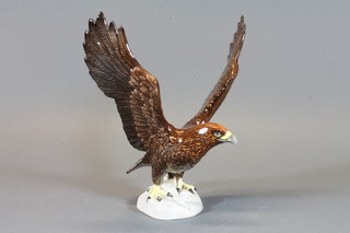 A Beswick golden eagle with wings outstretched, base marked 20  62 10.5"