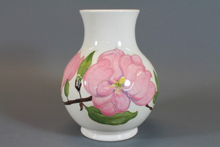 A Moorcroft limited edition vase decorated magnolia, the base marked 8/200 pieces 869/91/2 1983 9"
