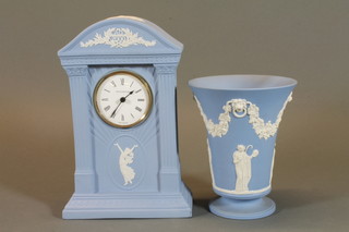 A Wedgwood blue Jasperware trumpet shaped vase decorated classical figures 6" and a Millennium commemorative arch  shaped mantel clock 9"