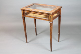A late Victorian rosewood bijouterie table, boxwood line inlaid  with a hinged glazed top, raised on square tapered legs 31.5"h x  26.5"w x 17"d