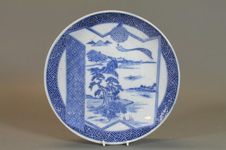 A 19th Century Japanese blue and white porcelain charger  decorated landscape 12"
