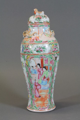 An early 20th Century Canton famille rose porcelain vase and cover decorated court figures 10.5", crack to rim   ILLUSTRATED