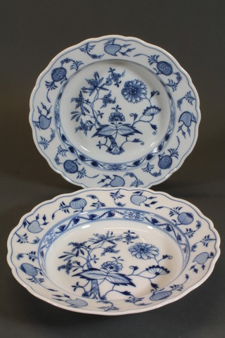 A pair of Meissen blue and white soup bowls, seconds with  struck through cross sword mark to base, 9.5"