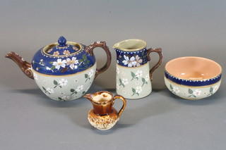A Victorian stoneware 3 piece tea service comprising teapot, sugar bowl and cream jug and salt glazed jug with vineous  decoration 2"