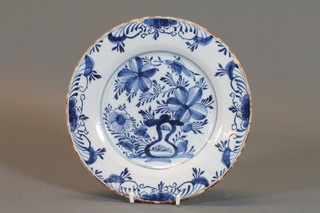 A 19th Century Delft blue and white plate with floral decoration 9"