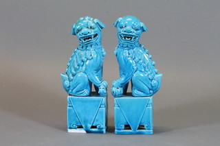 A pair of European turquoise glazed figures of Dogs of Fo 8"