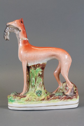 A 19th Century Staffordshire figure of a standing greyhound with  hare 12"