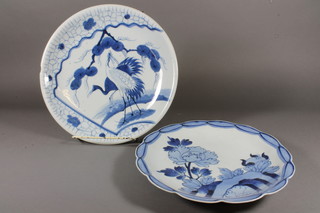 A circular Japanese porcelain charger decorated a stork 13" and 1  other with floral decoration 11"