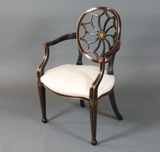A late George III style ebonised and parcel gilt elbow chair, the  hoop back centred with a radiating splat, scroll arms raised on  moulded square tapered legs