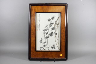 3 20th Century Japanese porcelain plaques with floral decoration contained in hardwood frames 16" x 10"