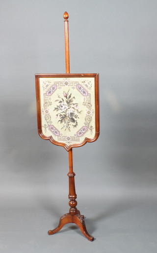 A late Victorian mahogany pole screen, having an adjustable wool and bead work panel, raised on baluster stem tripod base,  59"h x 16"w