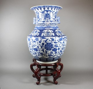 A pair of impressive Chinese blue and white vases, raised on  stands 22"h