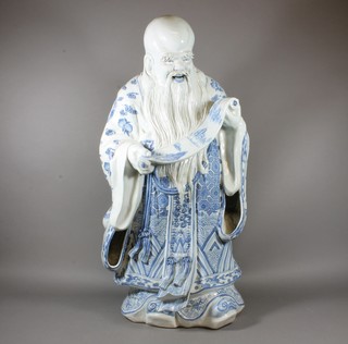 A Chinese blue and white figure of a standing God 33"   ILLUSTRATED