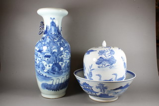 A Chinese blue and white bowl, the interior decorated a lake, mountain and bridge 16", an oval blue and white jar and cover  decorated birds 13" and a blue and white club shaped vase  decorated landscape 23"