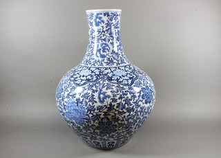A Chinese blue and white porcelain vase of ovoid squat form  with floral decoration 23.5"  ILLUSTRATED