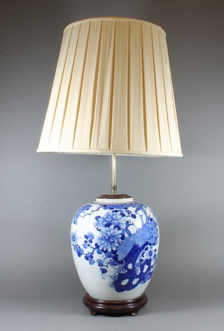 A Chinese blue and white ginger jar decorated bird amidst  branches, converted to a table lamp 14"