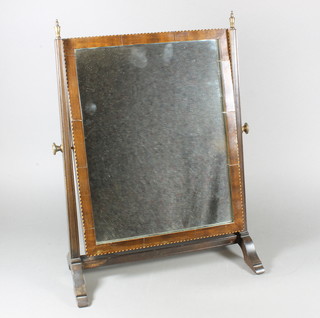 A 19th Century mahogany toilet mirror raised on splayed  supports 19"h x 13.75"w x 7"d
